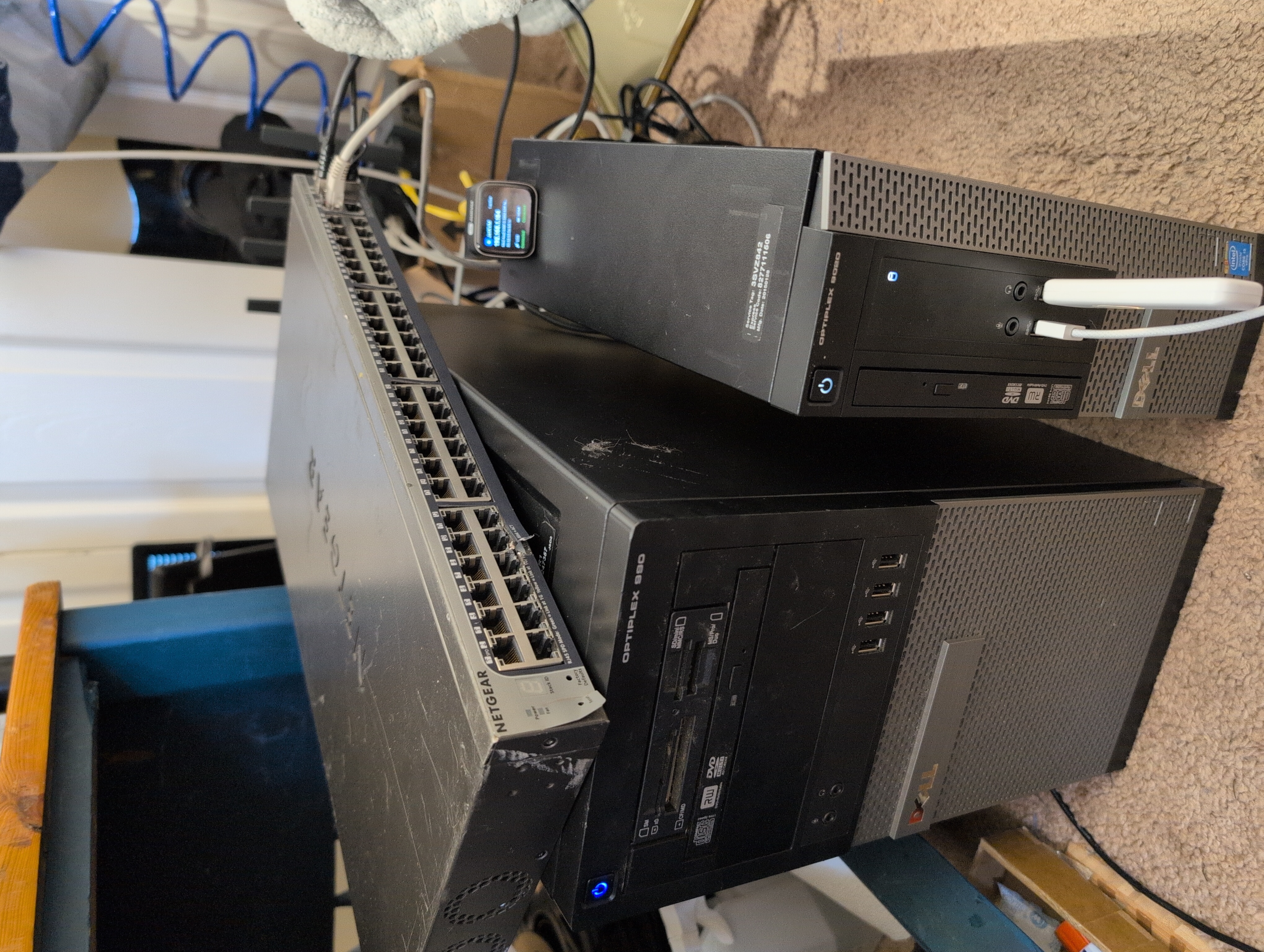 Dell OptiPlex 990 and 9020 servers stacked with a Netgear switch